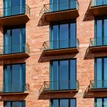 건축자재 마케팅과 브랜디드 콘텐츠 - **Prompt for "Authentic Voice: Telling Stories that Resonate in Every Brick":**
"A wide-angle, c...